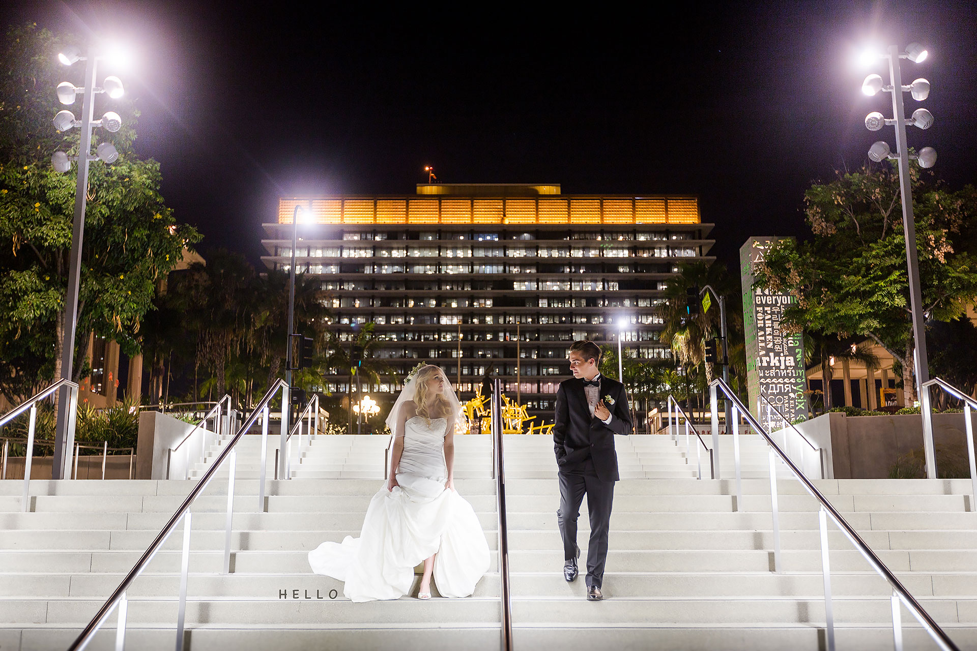 A wedding couple on steps at night captured by photographer Thomas Kim.