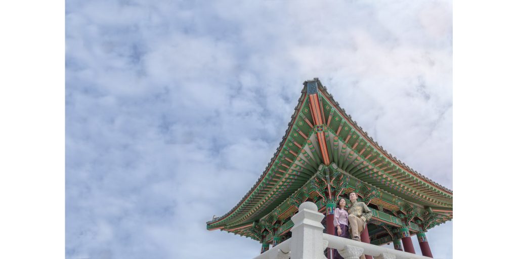 A Wedding photographer named Thomas Kim captures a chinese pagoda against a cloudy sky.