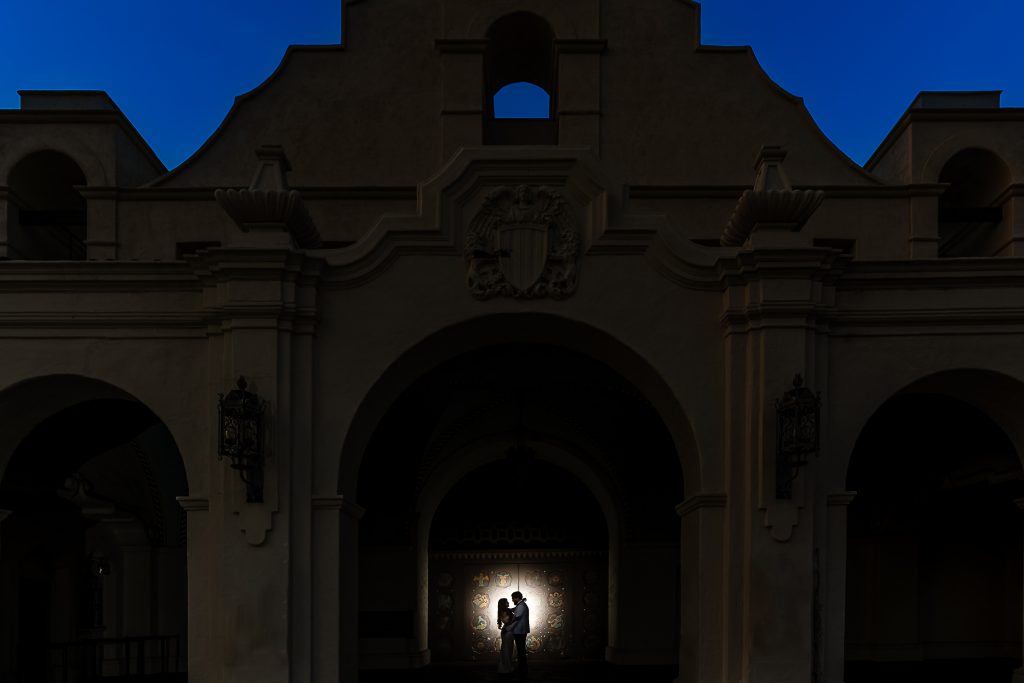 ThomasKim_photography A couple standing in front of a building at night for G & A moment.