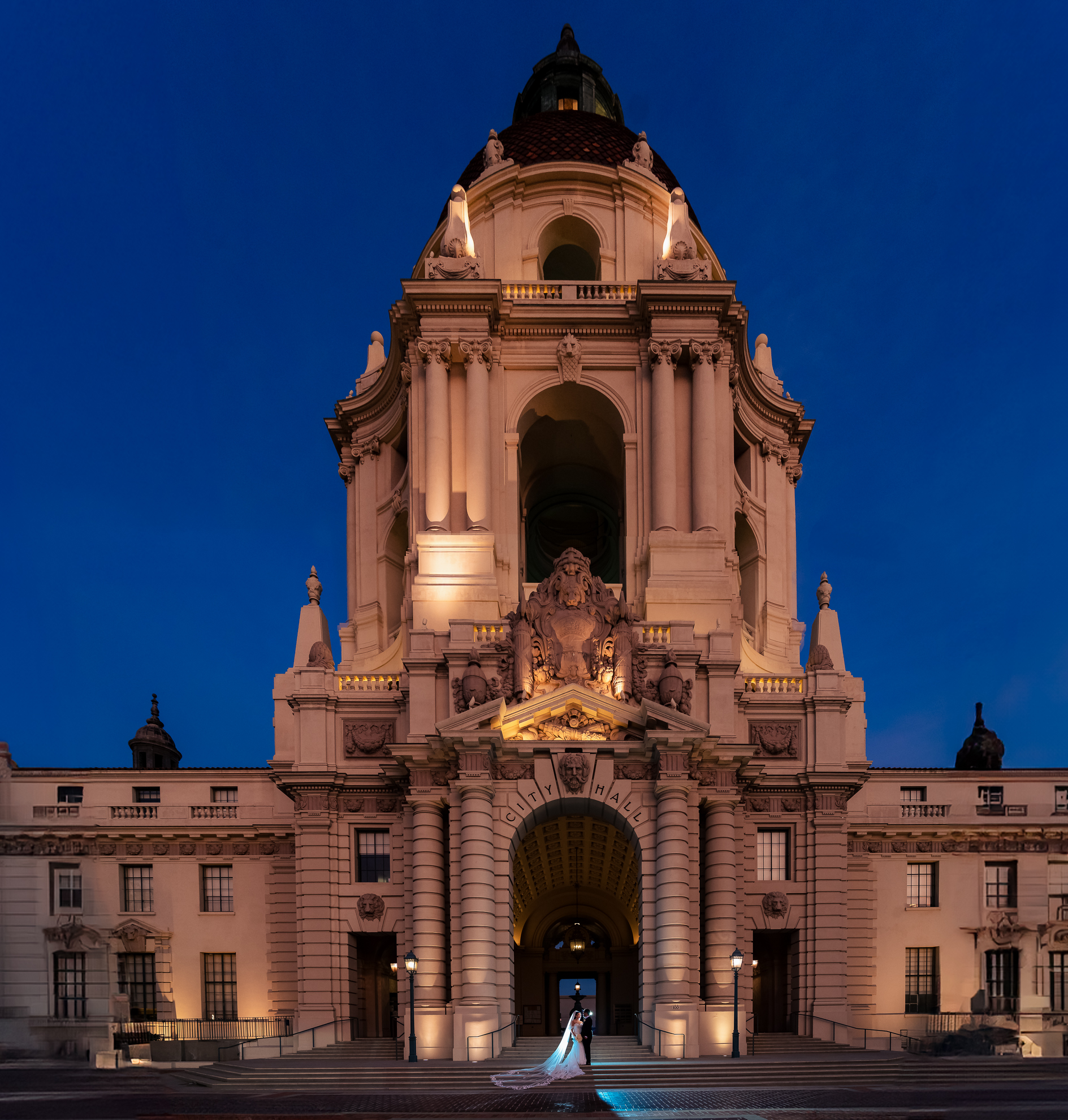 ThomasKim Photography Los Angeles Wedding Photographer M & M, a bride and groom standing in front of an ornate building at night.