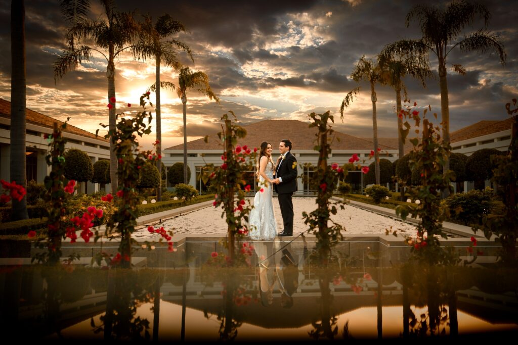 ThomasKim Photography Los Angeles Wedding Photographer A newlywed couple poses together outdoors at sunset