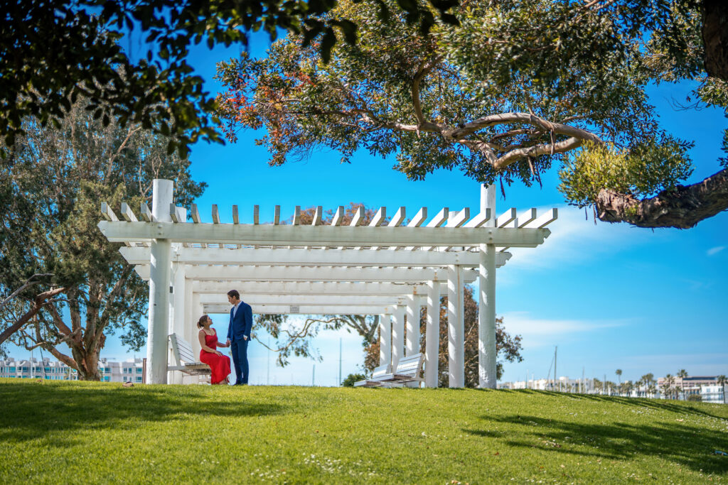 ThomasKim Photography Los Angeles Wedding Photographer A couple standing under a pergola on a grassy area
