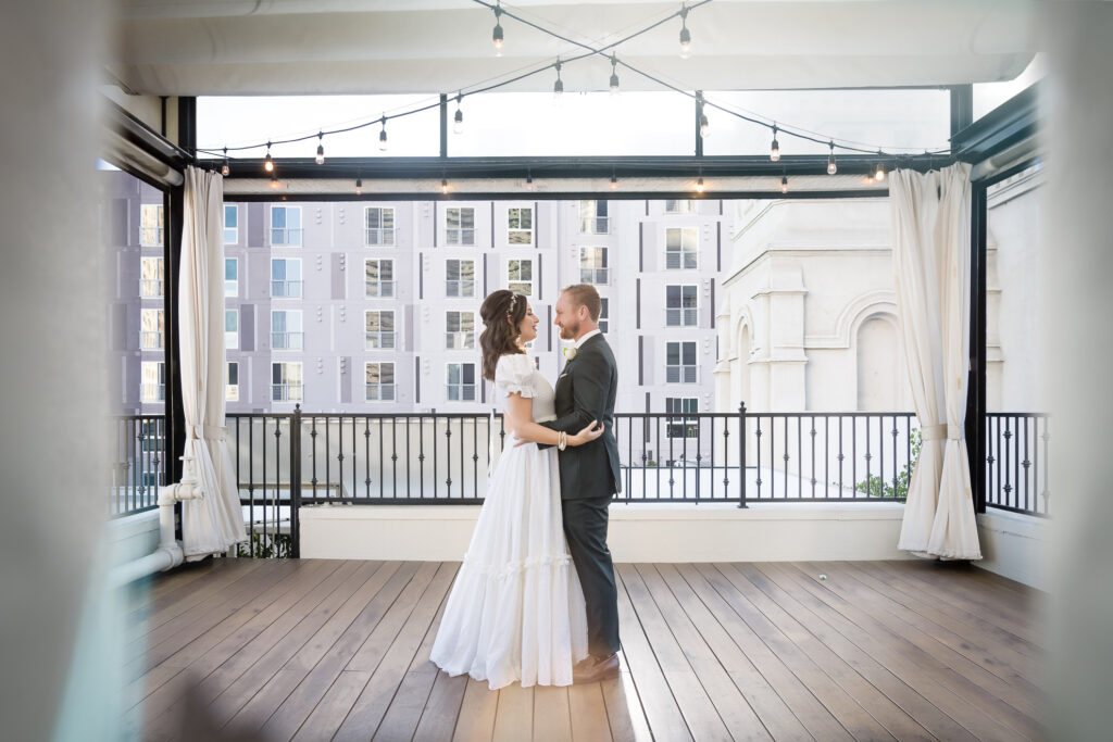 ThomasKim_photography A couple standing on a balcony.