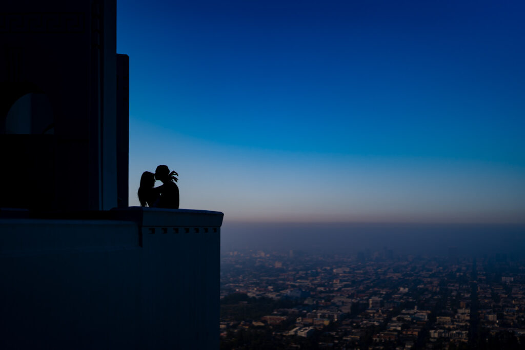 |ThomasKim_photography Bride and groom - V & J Engagement Session.|ThomasKim_photography V & J Griffith Observatory Engagement Session.|ThomasKim_photography A couple's engagement session with a telescope in the background.|ThomasKim_photography A black and white photo of a man and woman embracing during their engagement session.|ThomasKim_photography V & J Engagement Session: A couple embracing beneath a tree.|ThomasKim_photography A man and woman embrace during their V & J engagement session under a tree.|ThomasKim_photography V and J share a romantic kiss under a tree during their engagement session.|ThomasKim_photography V & J engagement session with a couple sitting on steps.|ThomasKim_photography V & J Engagement Session: A couple posing for a photo during their engagement session.|ThomasKim_photography V & J couple's engagement session on steps.|ThomasKim_photography A couple sitting on steps in front of a building during their engagement session.|ThomasKim_photography V and J Engagement Session featuring a couple kissing on the cheek.|ThomasKim_photography Keywords: Kissing