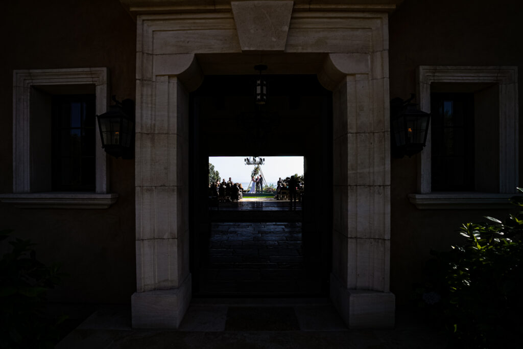 ThomasKim_photography A professional wedding photographer capturing a doorway with a beautiful light shining through it.|ThomasKim_photography A professional wedding photographer captures the emotional embrace of a bride and groom in front of a circular window.|ThomasKim_photography A professional wedding photographer captures a bride and groom kissing under a tree.|ThomasKim_photography A professional wedding photographer capturing a bride and groom dancing under a tent in the dark.|ThomasKim_photography Keywords: Professional Wedding Photographer.|ThomasKim_photography Keywords: group