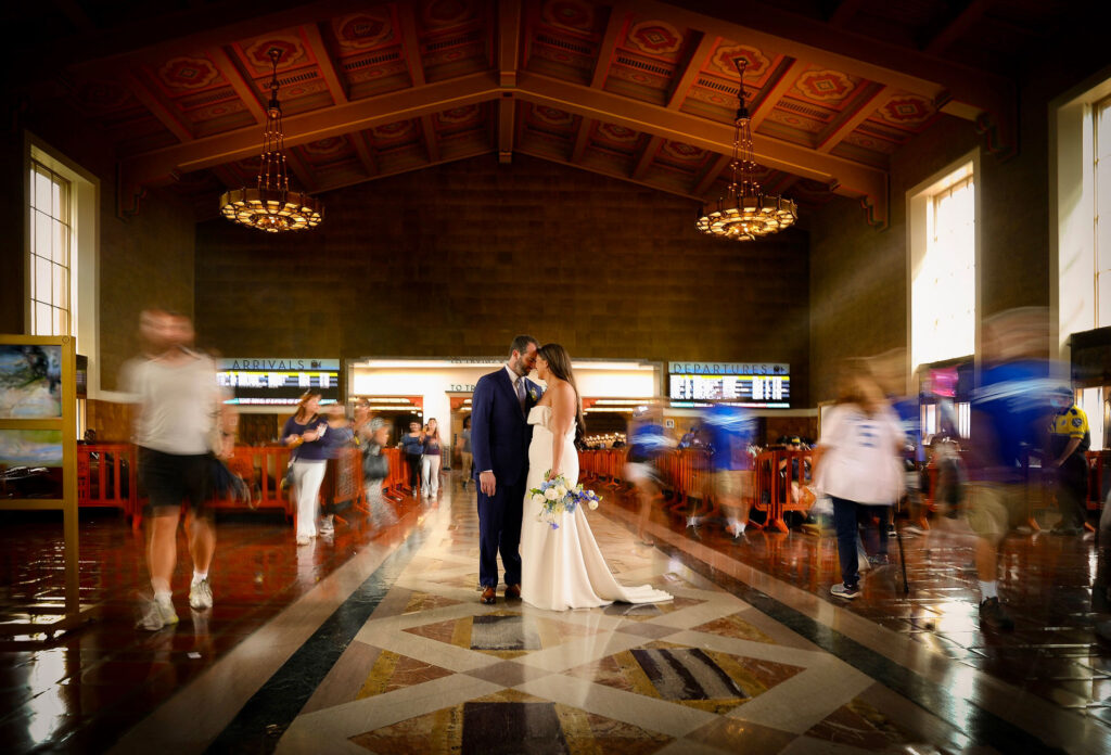ThomasKim_photography A breathtaking bride and groom kissing in a train station