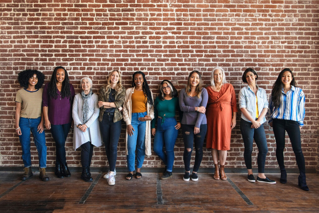 ThomasKim Photography Los Angeles Wedding Photographer A group of multicultural women standing in front of a brick wall